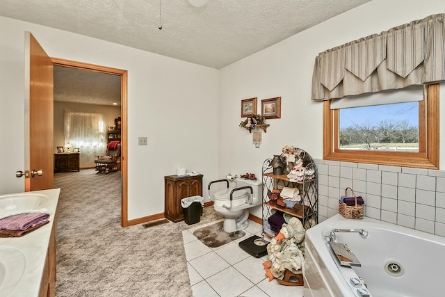 bathroom with a whirlpool tub, a textured ceiling, plenty of natural light, and toilet