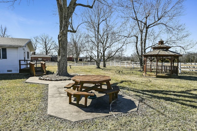 view of yard featuring a gazebo, a patio, and a fenced backyard