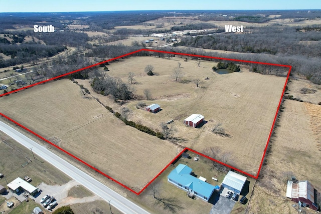 birds eye view of property featuring a rural view