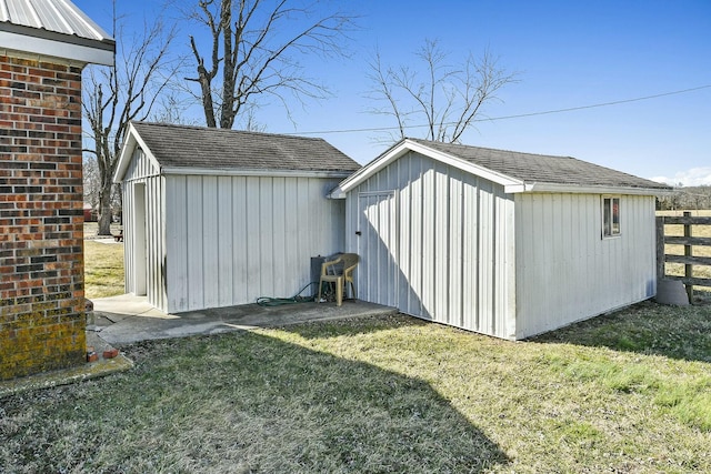 view of shed with fence