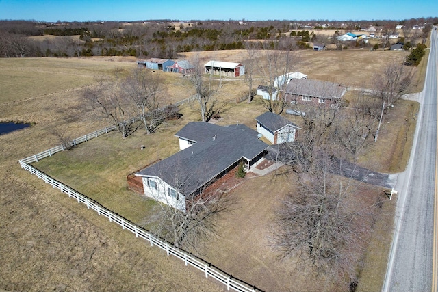 birds eye view of property with a rural view