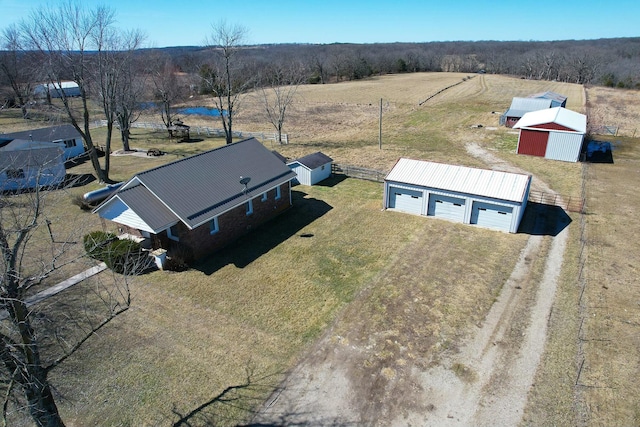 birds eye view of property featuring a rural view