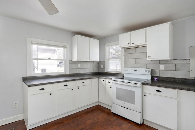 kitchen with tasteful backsplash, dark countertops, dark wood-type flooring, and electric range