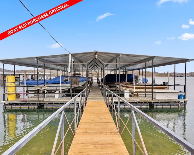 dock area with a water view and boat lift