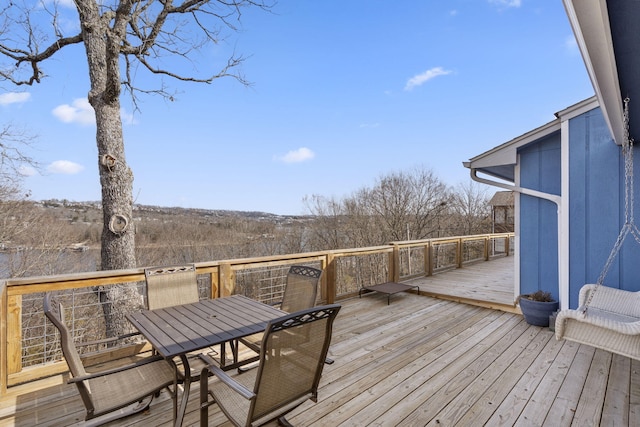 deck with outdoor dining area