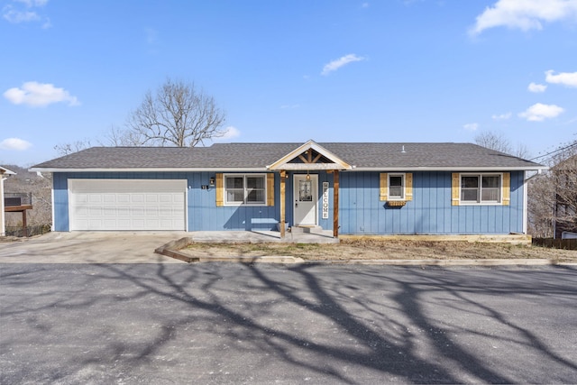 ranch-style house with a garage, concrete driveway, and roof with shingles