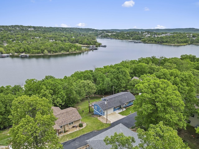 aerial view featuring a water view and a view of trees