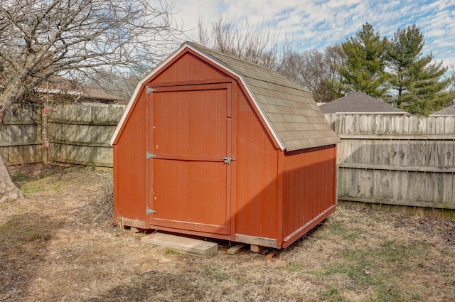 view of shed with a fenced backyard