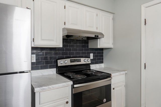 kitchen featuring tasteful backsplash, appliances with stainless steel finishes, white cabinets, and under cabinet range hood