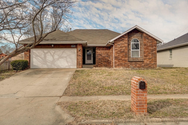 ranch-style home with an attached garage, brick siding, a shingled roof, driveway, and a front yard