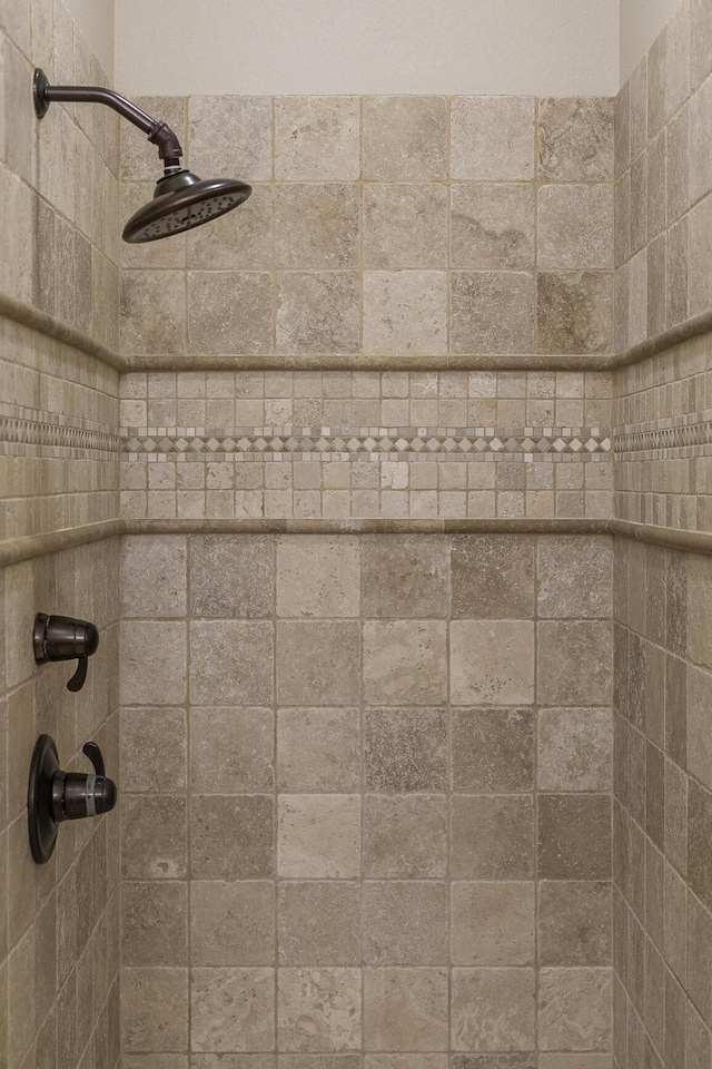 details featuring a tile shower