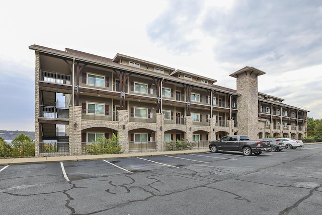 view of property with uncovered parking