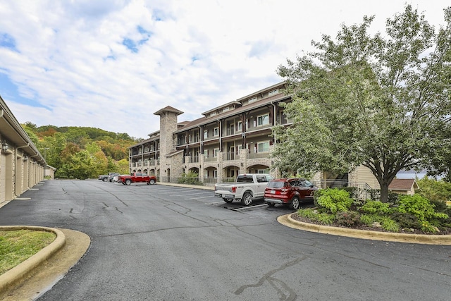 view of building exterior featuring uncovered parking