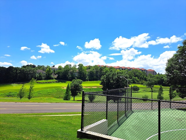 exterior space featuring a yard and fence