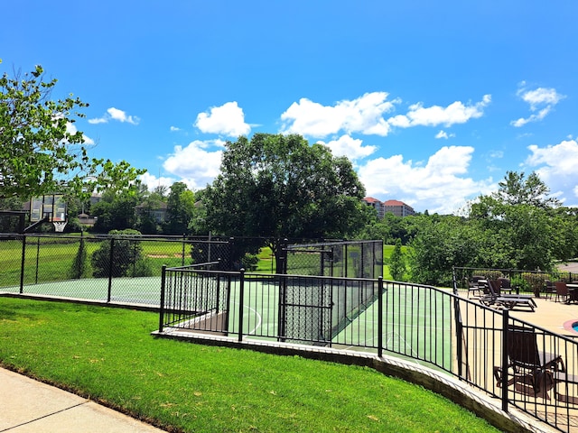 surrounding community featuring a lawn and fence