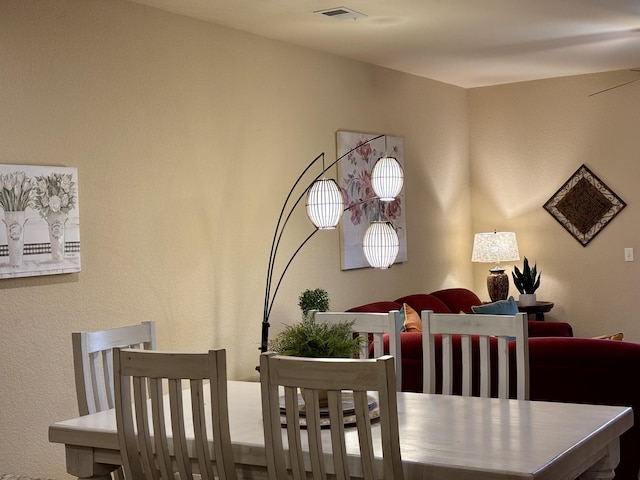 dining space featuring visible vents