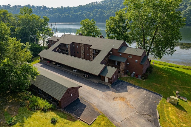 bird's eye view featuring a water view and a view of trees