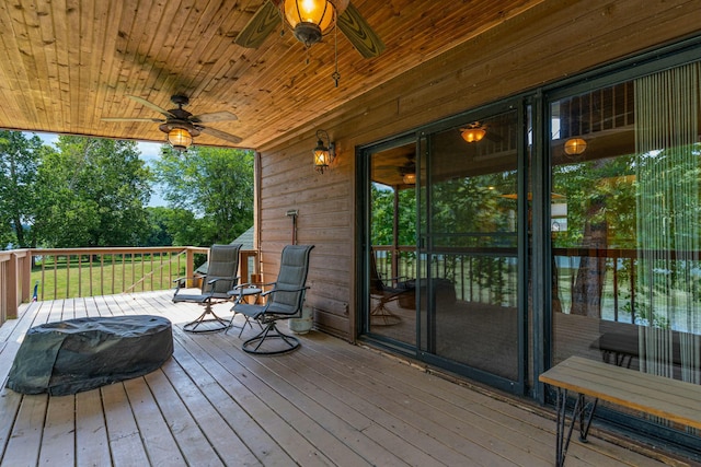 wooden deck featuring ceiling fan