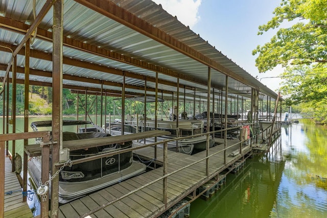 view of dock featuring a water view and boat lift