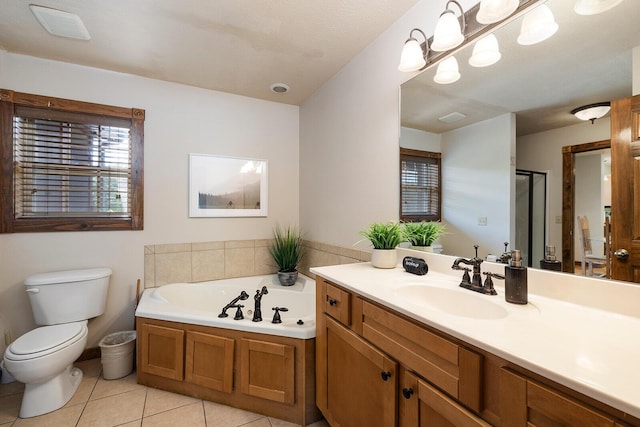 bathroom featuring a stall shower, toilet, tile patterned flooring, vanity, and a bath