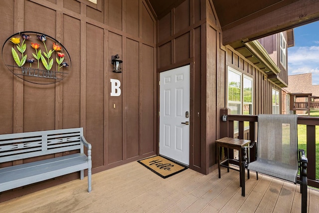 view of exterior entry featuring board and batten siding