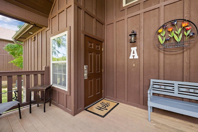 view of exterior entry with board and batten siding