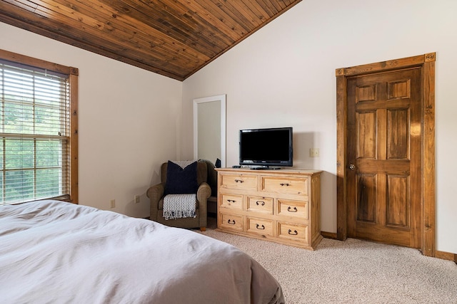 bedroom featuring lofted ceiling, wooden ceiling, baseboards, and light colored carpet