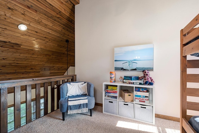 sitting room featuring carpet and baseboards