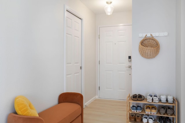 doorway to outside with light wood-style floors