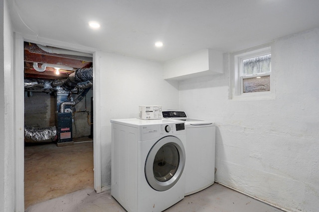 clothes washing area featuring laundry area and washing machine and clothes dryer