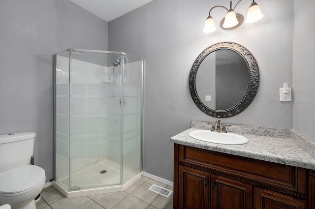 bathroom with visible vents, a shower stall, toilet, and tile patterned floors