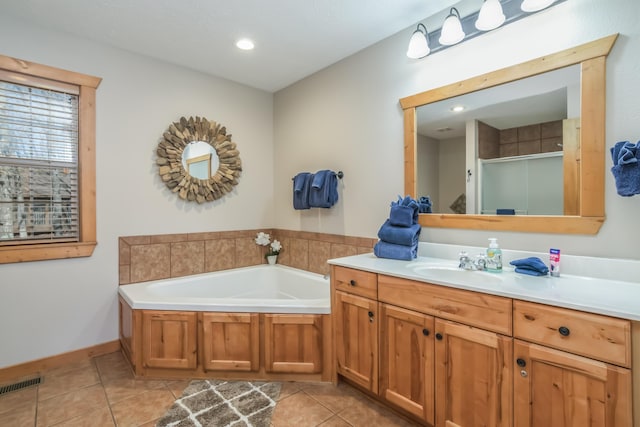 full bathroom featuring a shower stall, vanity, visible vents, and tile patterned floors