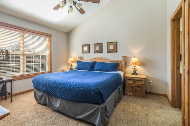 bedroom featuring vaulted ceiling, light carpet, a ceiling fan, and baseboards