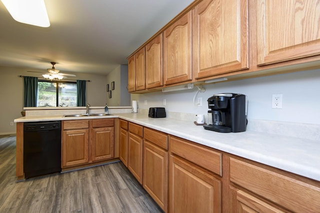 245 Wildflower Rd, Kimberling City, MO 65686 - kitchen with black dishwasher, dark wood-style flooring, light countertops, a sink, and a peninsula