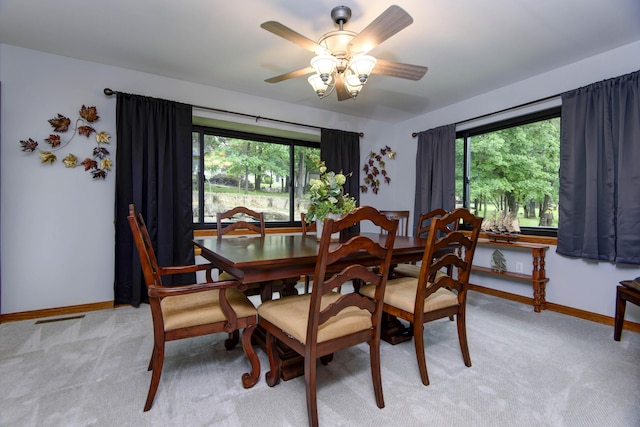 245 Wildflower Rd, Kimberling City, MO 65686 - dining area with baseboards, ceiling fan, visible vents, and light colored carpet