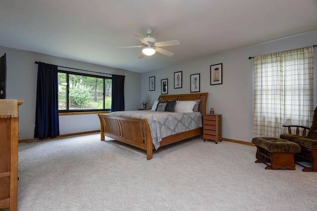 245 Wildflower Rd, Kimberling City, MO 65686 - carpeted bedroom with baseboards and a ceiling fan