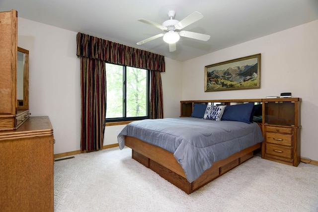 245 Wildflower Rd, Kimberling City, MO 65686 - bedroom featuring baseboards, ceiling fan, visible vents, and light colored carpet