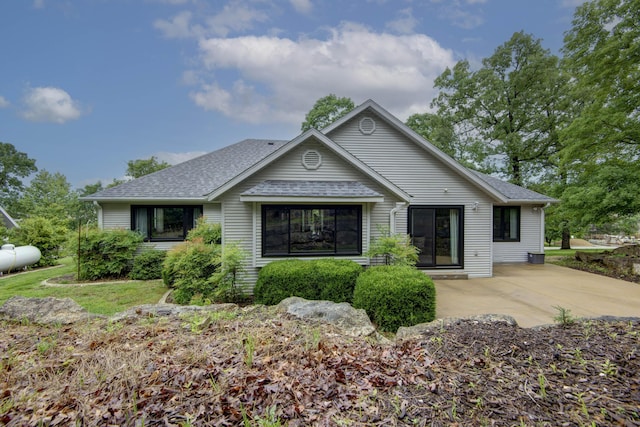245 Wildflower Rd, Kimberling City, MO 65686 - view of front of house featuring a shingled roof and a patio
