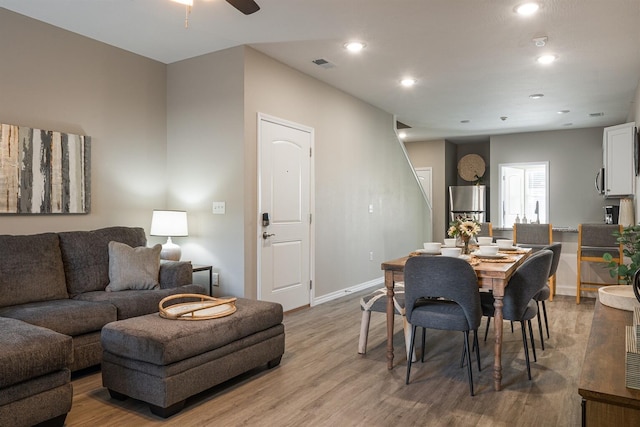 dining area featuring light wood-style floors, baseboards, visible vents, and recessed lighting