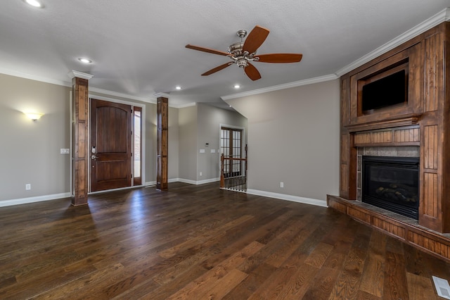 unfurnished living room with dark wood-style floors, crown molding, recessed lighting, and baseboards