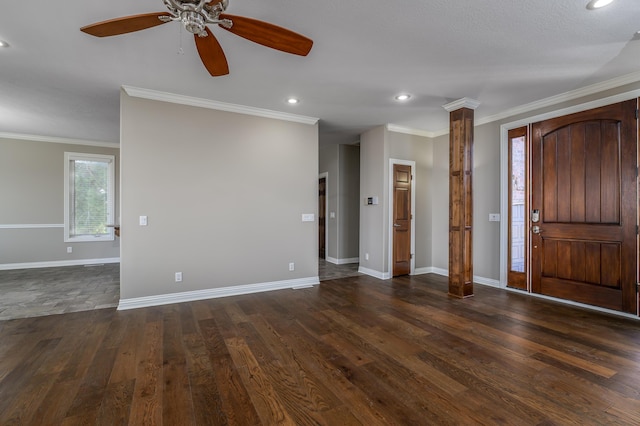 foyer featuring dark wood-style flooring, recessed lighting, ornate columns, ornamental molding, and baseboards