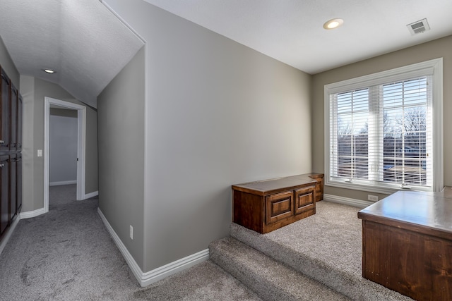 office area featuring baseboards, visible vents, lofted ceiling, carpet flooring, and recessed lighting