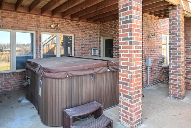 view of patio / terrace featuring a hot tub