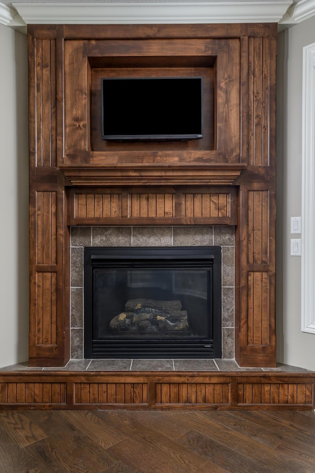 interior details with a fireplace and wood finished floors