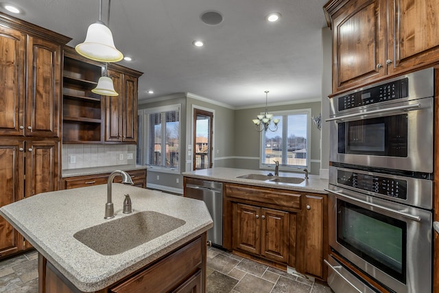 kitchen featuring stainless steel appliances, a sink, a warming drawer, and stone tile floors