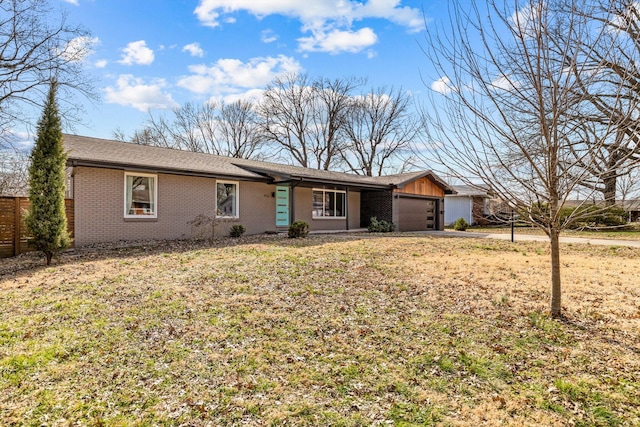 single story home featuring a garage, brick siding, a front lawn, and fence