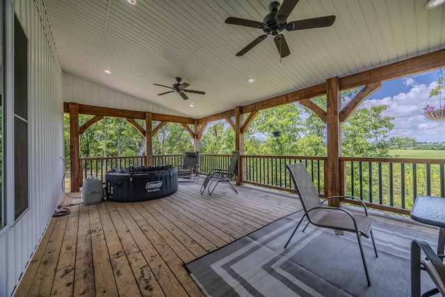 wooden deck featuring ceiling fan