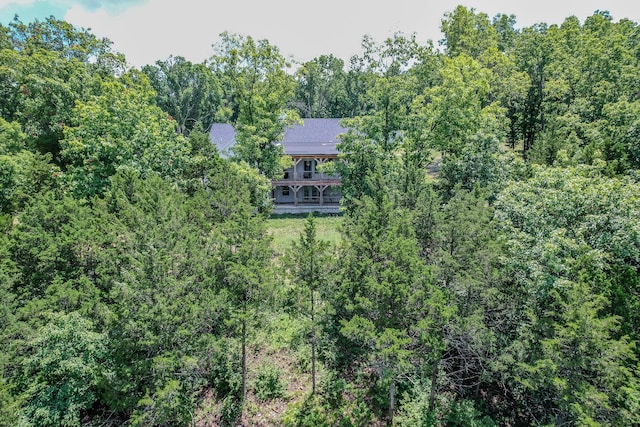 drone / aerial view featuring a view of trees