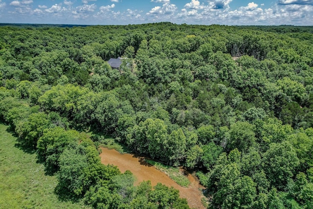 birds eye view of property with a wooded view