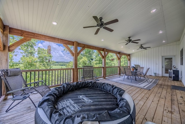 wooden deck with ceiling fan and outdoor dining space